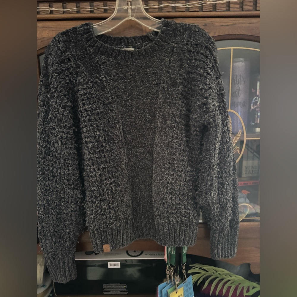 Cozy Charcoal Sweater tag says XL but it runs smaller than that
